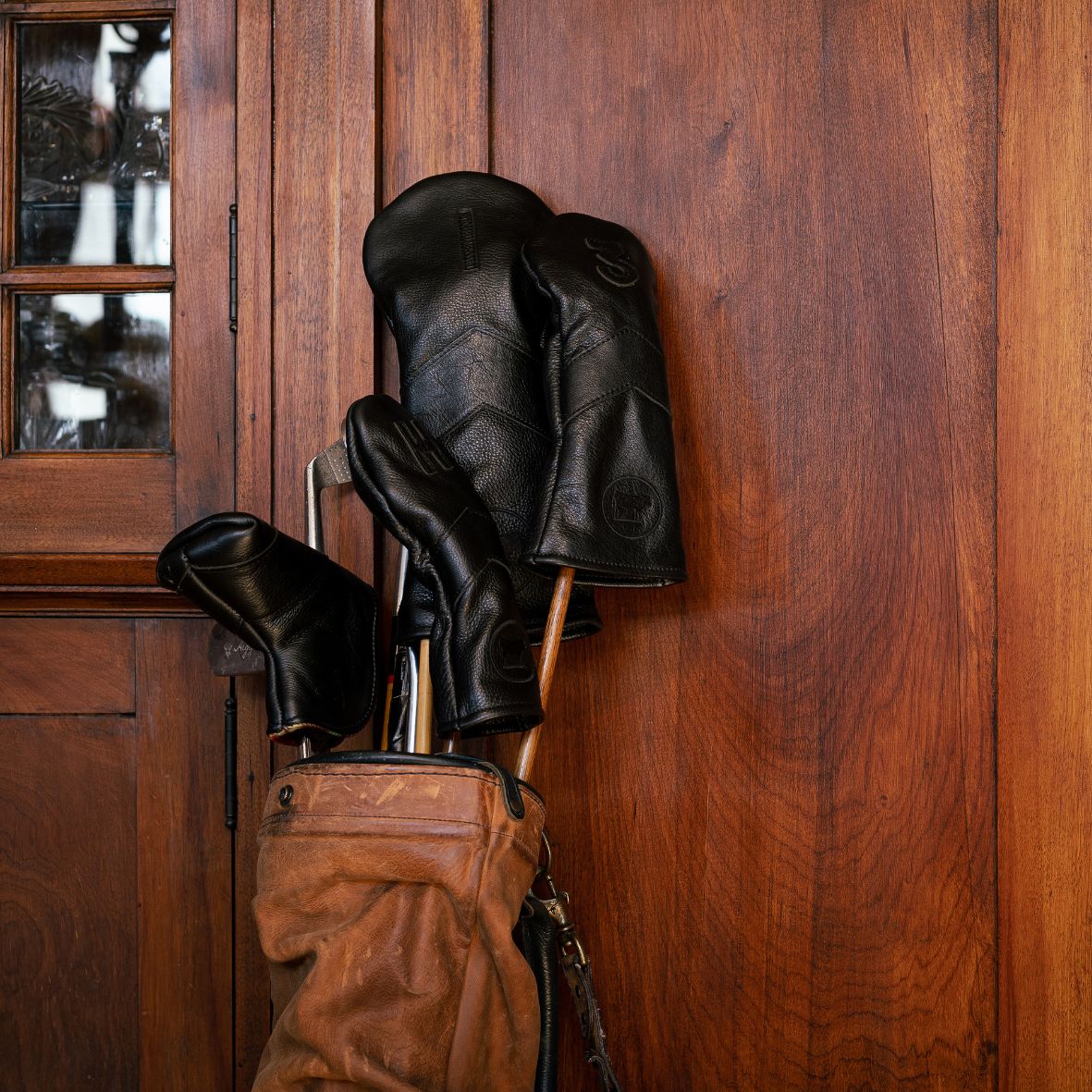 Golf Head Covers in Black on a set of hickories in a Sunday bag